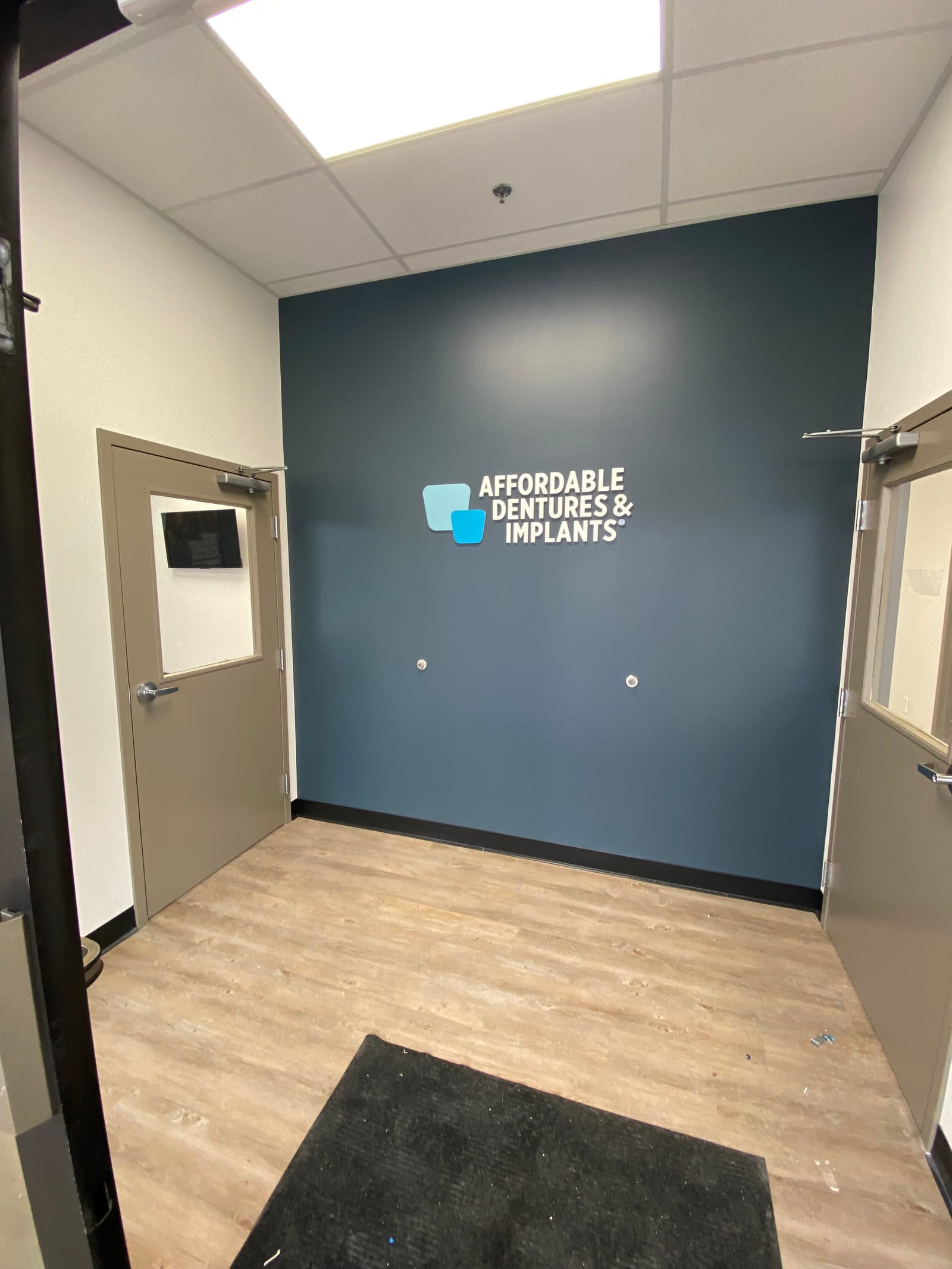 Affordable Dentures & Implants, a hospital painting project completed by Straight Line Painting