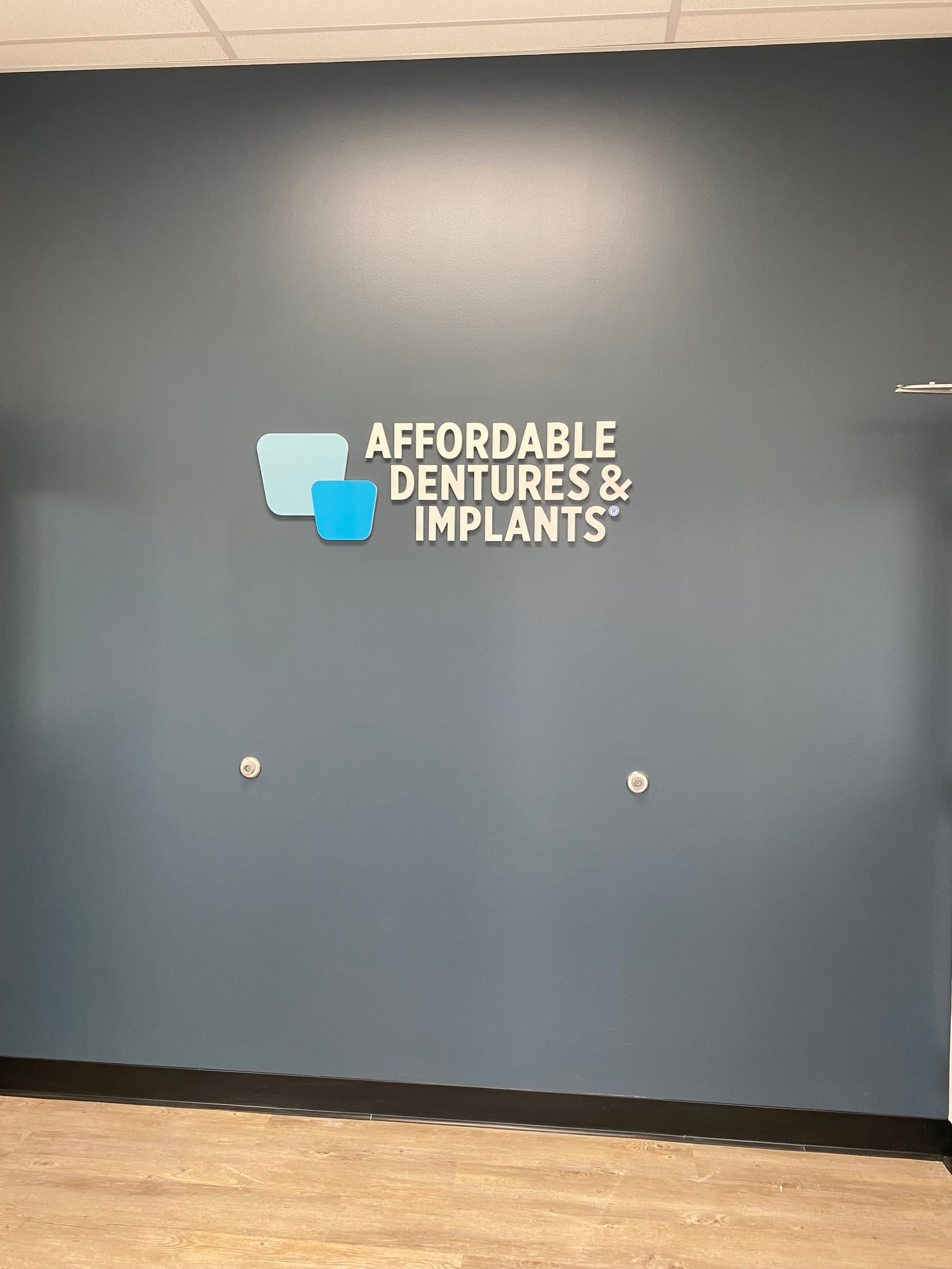 Affordable Dentures & Implants, a hospital painting project completed by Straight Line Painting