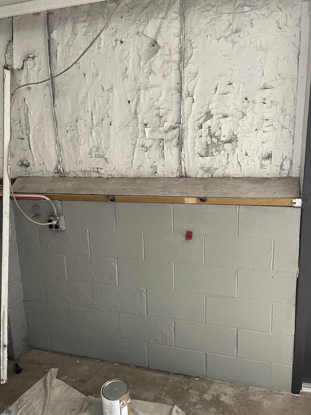 Repainted auto dealership showroom interior with new wall finish