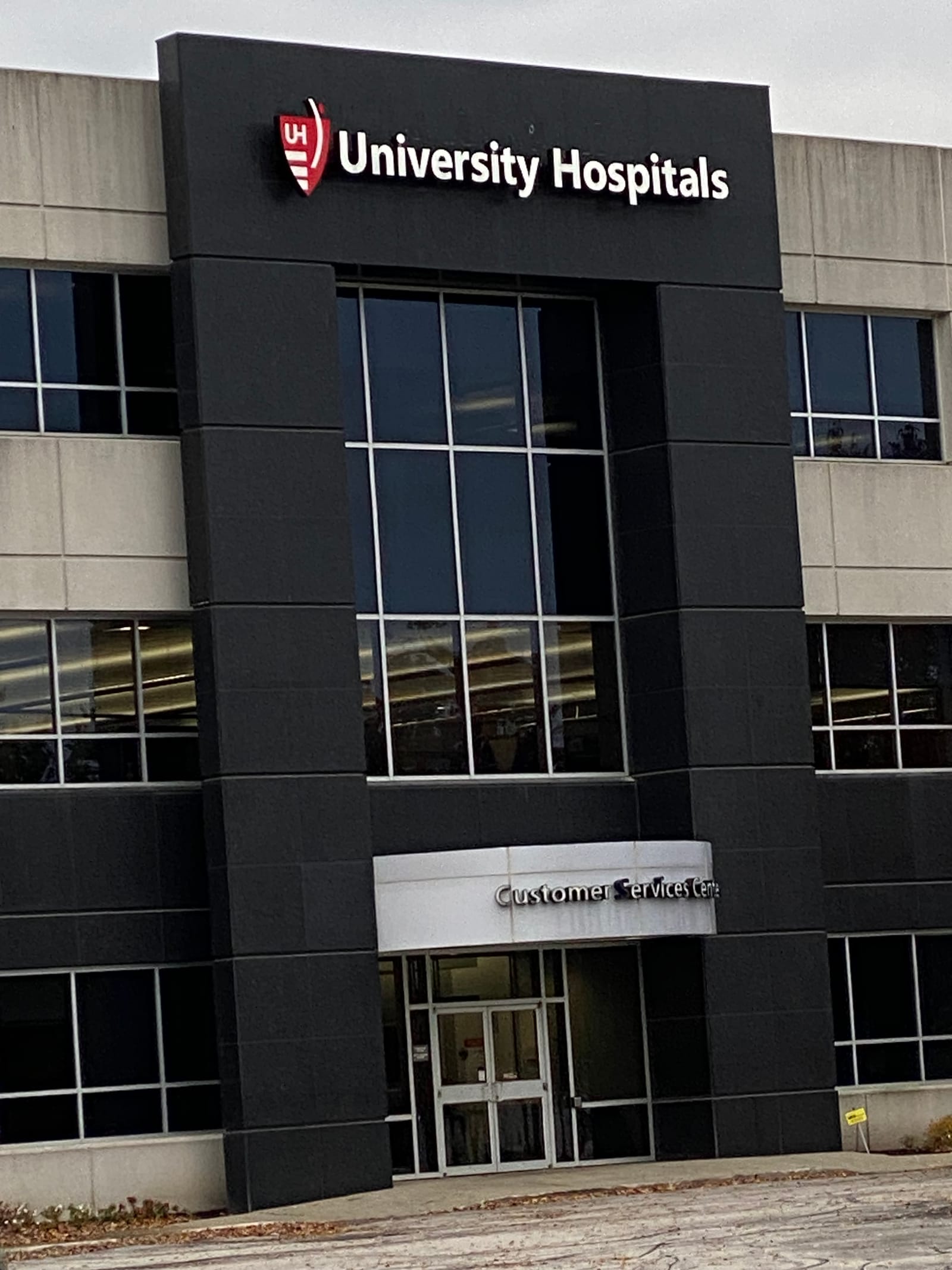 The University Hospitals building exterior with its branded signage, repainted by Straight Line Painting