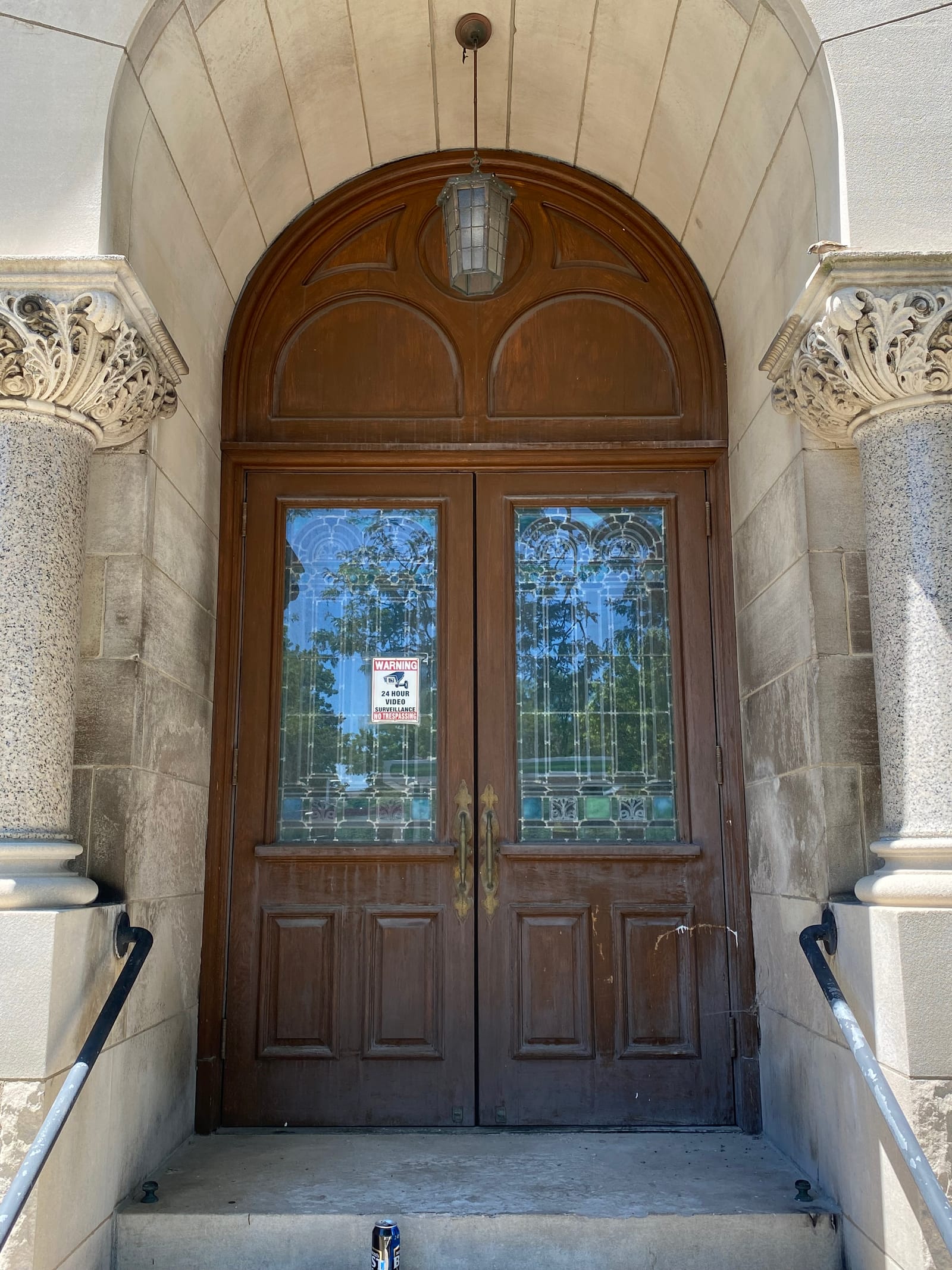 A 116-year-old building's historic entrance, a renovation painting project completed by Straight Line Painting