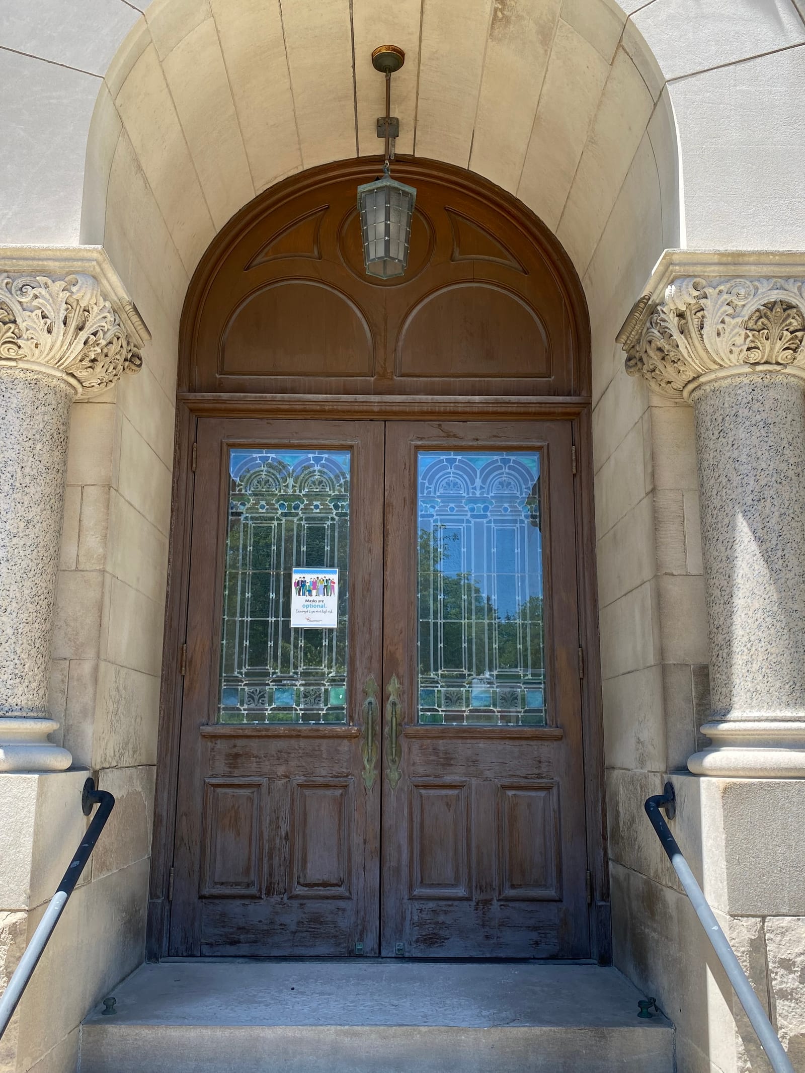 A 116-year-old building's historic entrance, a renovation painting project completed by Straight Line Painting