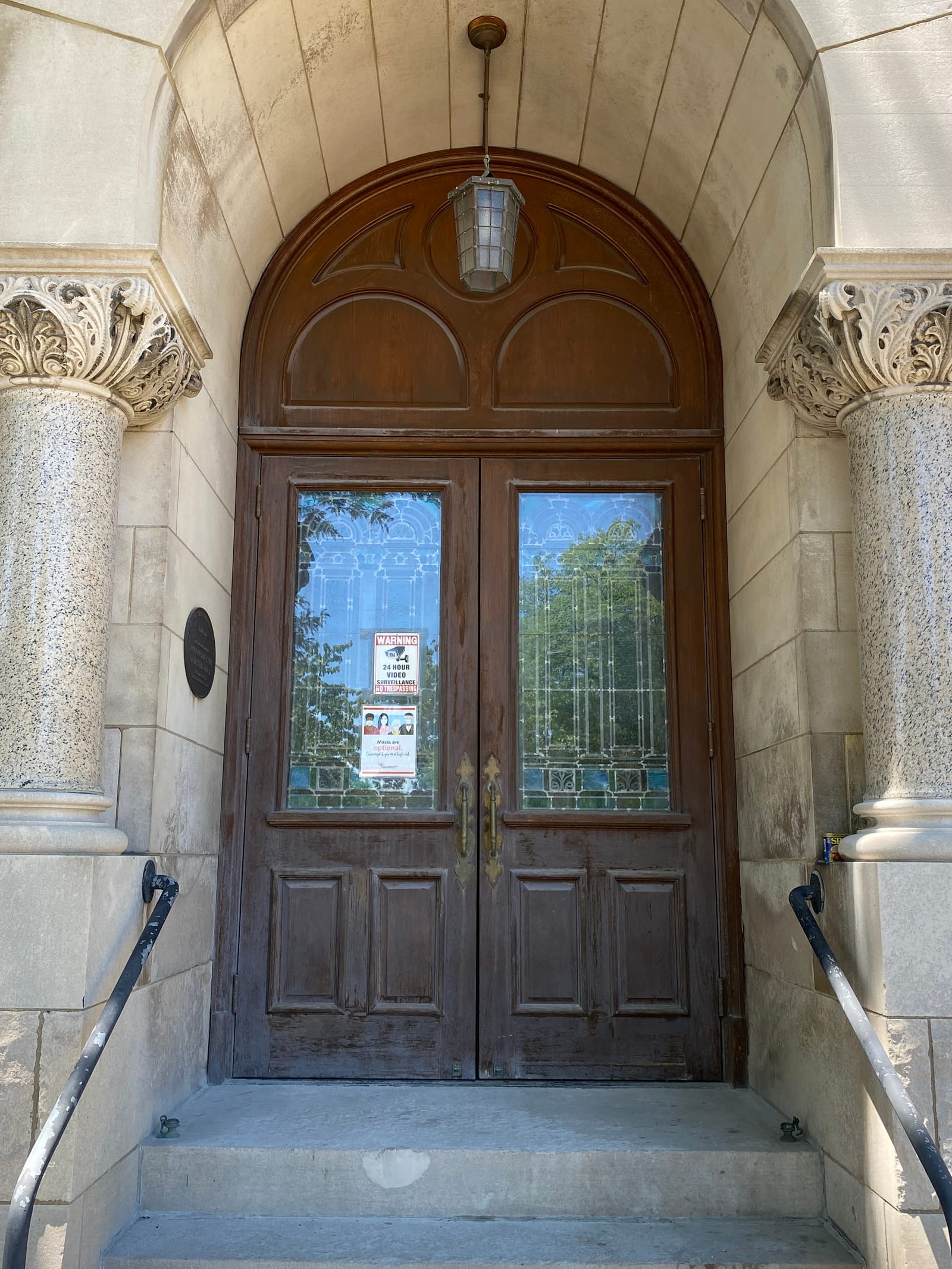 A 116-year-old building's historic entrance, a renovation painting project completed by Straight Line Painting