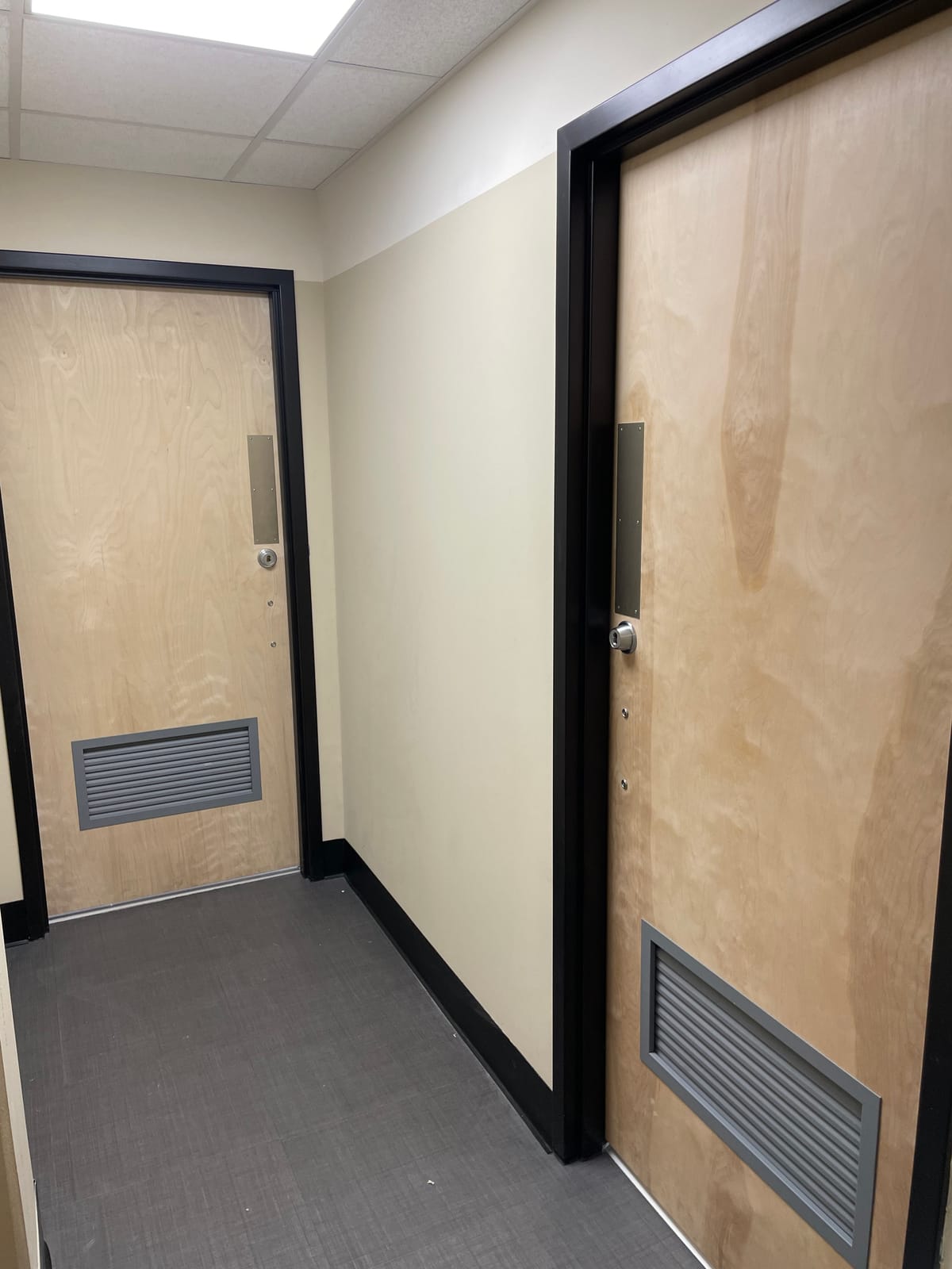 Freshly painted corridor with new door frames at a Tri-C campus building