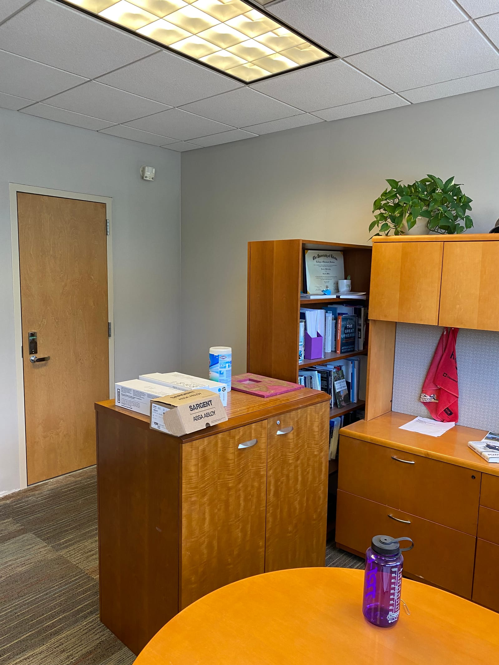 Finished open office suite at Cuyahoga Community College, painted walls and ceiling grid with workstations in place