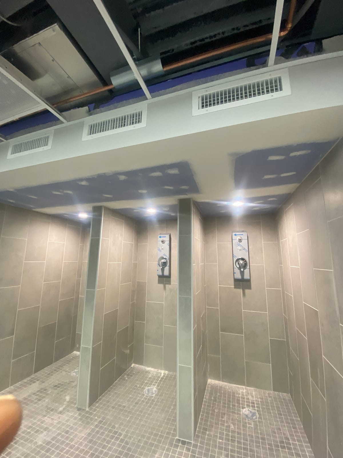 New tiled shower stalls in a renovated locker room at an Ohio Army National Guard armory